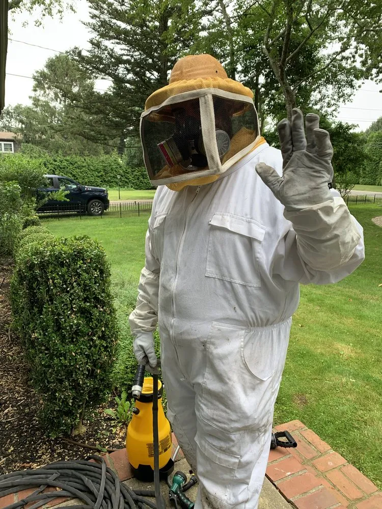 Licensed PC Las Cruces technician in full protective gear before a treatment visit